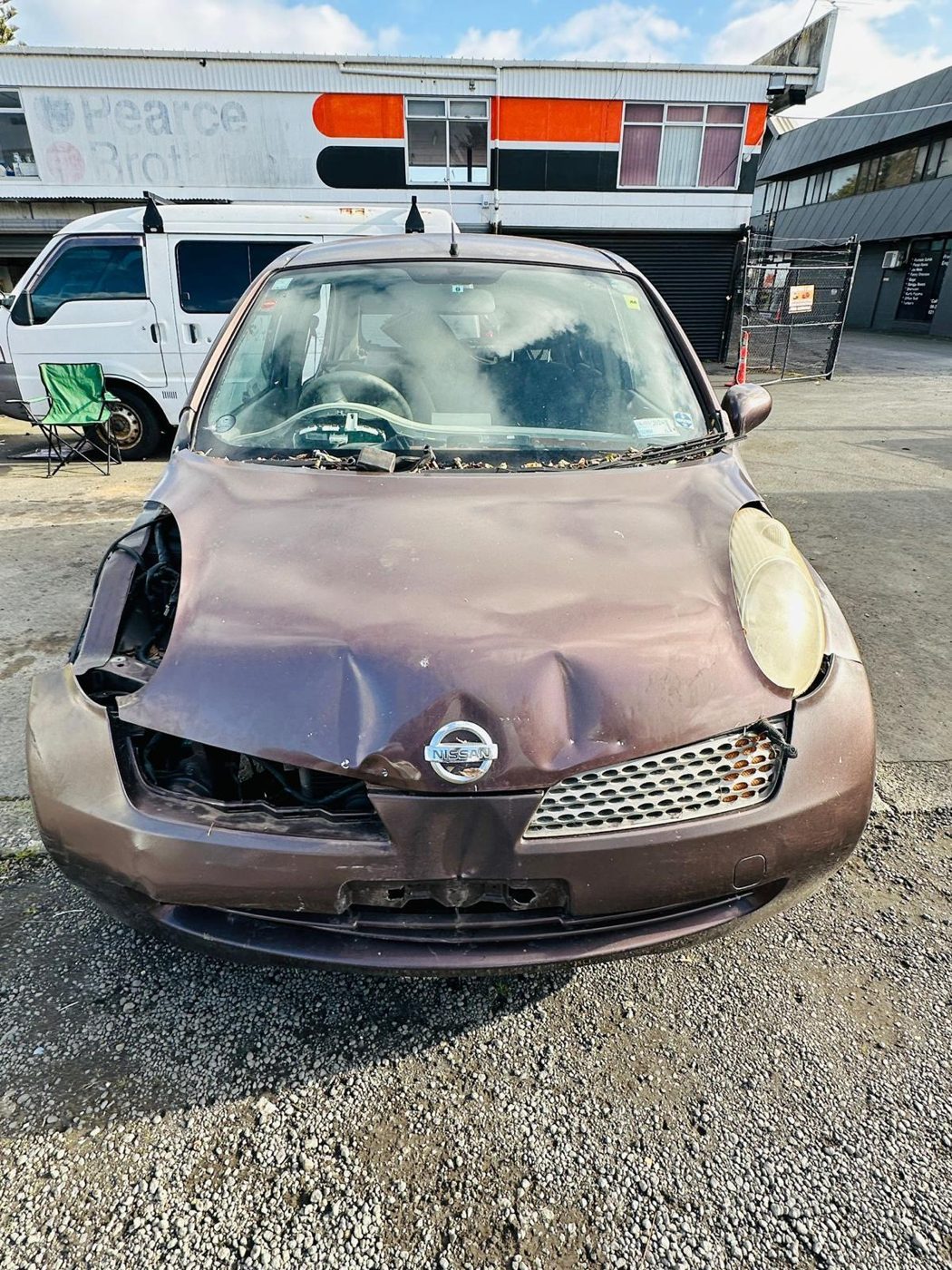 Crash-damaged Nissan March bought for cash in Auckland