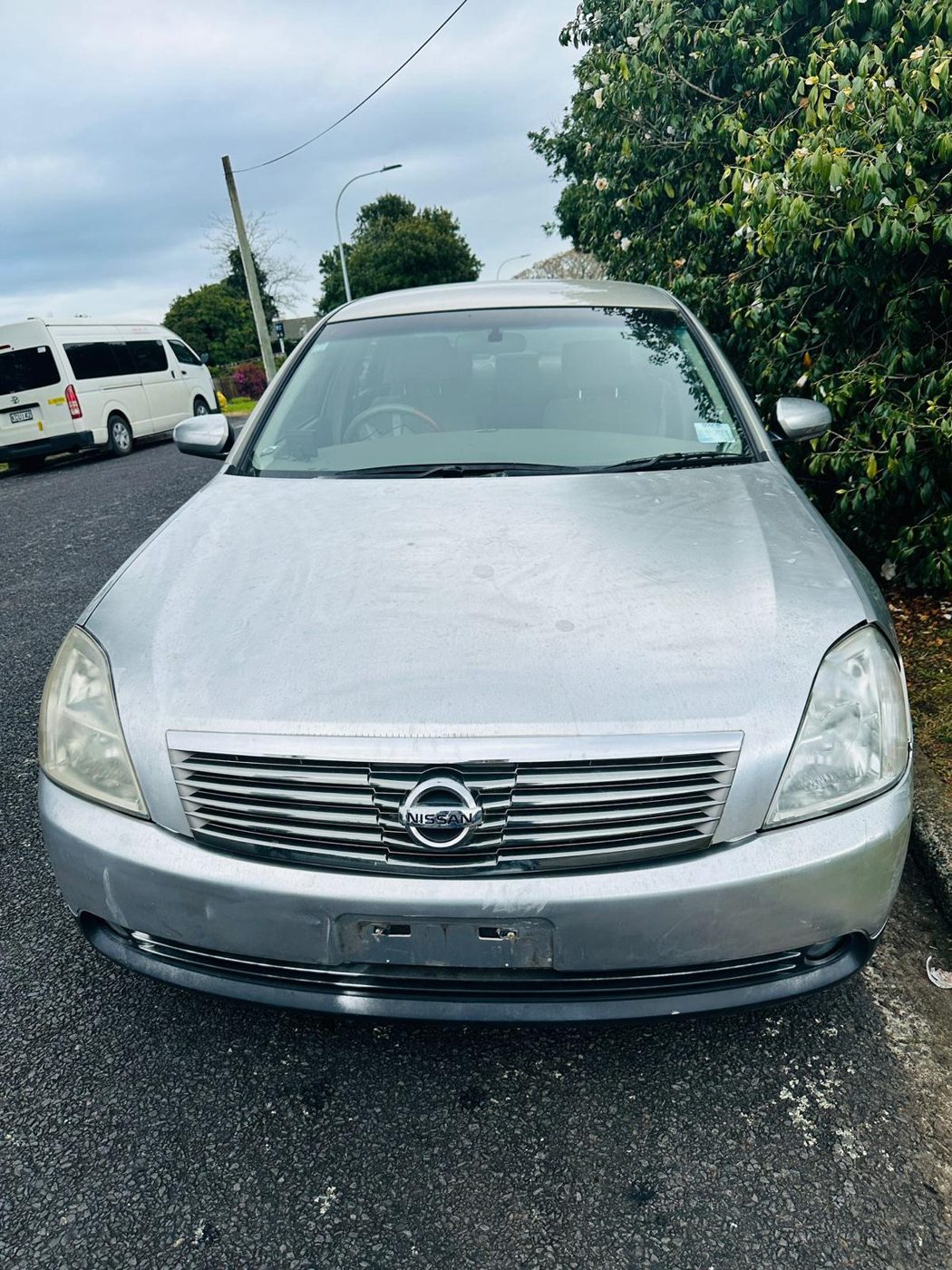 Silver Nissan Teana sedan ready for cash-for-cars pickup in Auckland